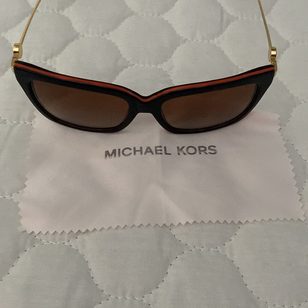 Sunglasses with an orange trim on top
